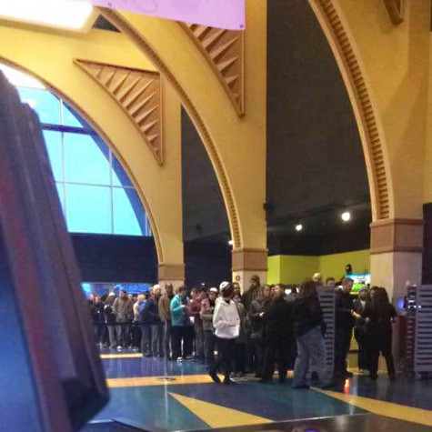 Employees of the Alderwood theater’s view of their own doom. Hundreds of people wait for the first showing of Star Wars. 