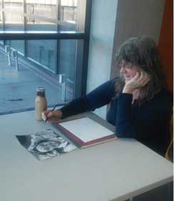 Student Kas Racine sits working on her art assignment in Whitehorse Hall. She graduated high school and college in the 70’s and now enjoys classes for enrichment.