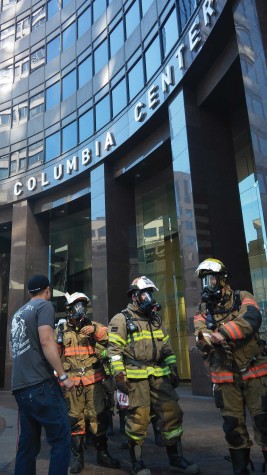 Teams of firefighters are geared up and ready to make the climb as they wait at the start line. 