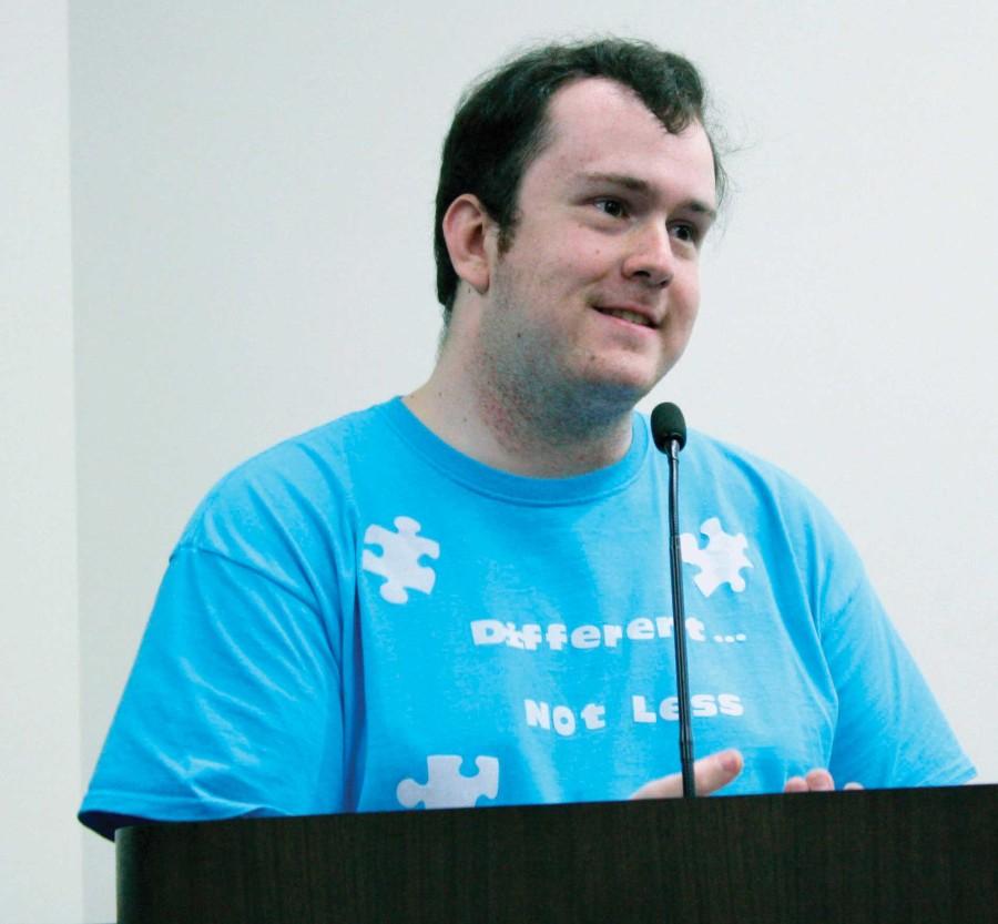 Nichols Eveland speaking in Jackson Center on April 9th at Different, Not Less: Autism Awareness. Nichols, who is autistic, shared his story and showed a video of people close to him to better inform others about autism. Photo Credit: Justyce Wright