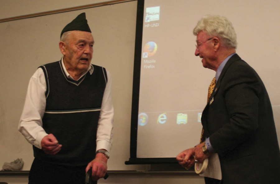 Friedman thanks a World War II vet after finishing his speech about surviving the Holocaust. 