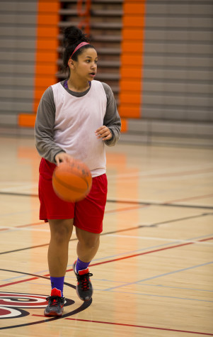 Makaliah Johnson looking over the defense after bringing the ball up court during practice on Oct 26 2015.
