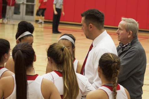 Nearing halftime Assistant Coach Wilde gives his team instruction, as the blowout ensued with Head Coach Chet Hovde looking on. 