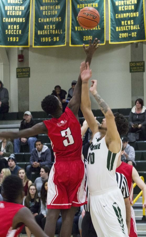 Said Hersi for the Trojans winning a jump ball at tip off against Shoreline Wednesday Jan. 27, 2016. 