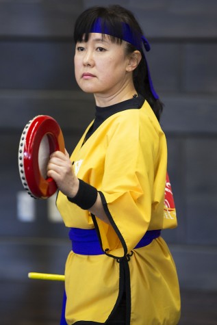 A member of OKK Taiko&Dance Group getting ready to play the drums, and bring joy and happiness to the event. 