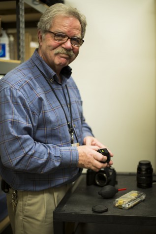 You will often find Gilbert in the equipment checkout room in Whitehorse Hall. He says that one of the hardest parts of his job is having to discipline students when they don't bring it back. 