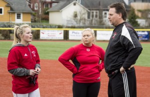 Kiana Smith (left) talks to Head Coach Randy Smith (right) and Assistant Coach Alex Kubeska (middle) at practice on March 2, 2016 at Everett’s softball field. 