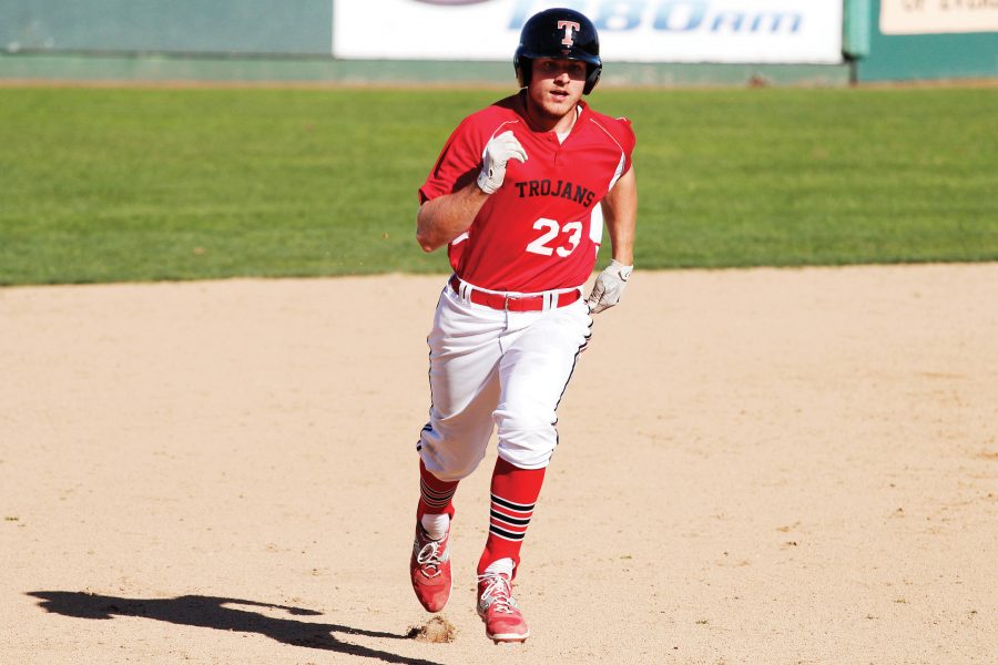 Jake Nelson trots safely to third base after a single from a teammate against Douglas College at Everett Memorial Stadium.