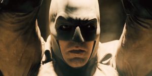 Batman, played by Ben Affleck, is de-masked as he is held captive.