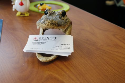 The stylish yet functional alligator that sits on Wisdom-Whitley's desk for those needing contact info. 