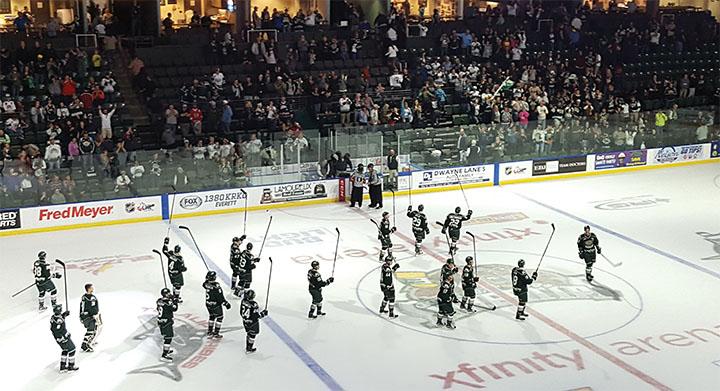 Everett Silvertips players celebrate after a 3-1 victory in their home opener against the Vancouver Giants on September, 24th 2016 at Xfinity Arena. 