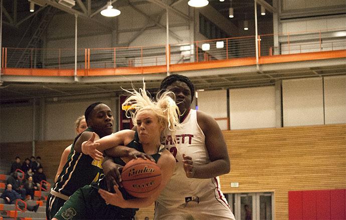 Uju Chibuogwu attempts to poke the ball loose from a Shoreline guard. 