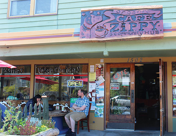 The front view of Cafe Zippy, located on 1502 Rucker Ave, with a few of their customers seen in front enjoying their meal.