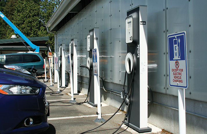 Charge it! Electric vehicle charging stations, located near the maintenance building, were provided by sustainability grants. Lately, those grants have been harder to come by. Molly Beeman, EvCC’s Sustainability and Resource Conservation Manager, says the proposed green fee “can actually help this college move towards lower emissions goals because the money will be collected from, but managed by and distributed by, students.” Max Tinsley affirms, “It’s entirely on the student’s terms. The benefit of that is we get to decide what our campus does. Every little project impacts us in some way… directly or indirectly.”