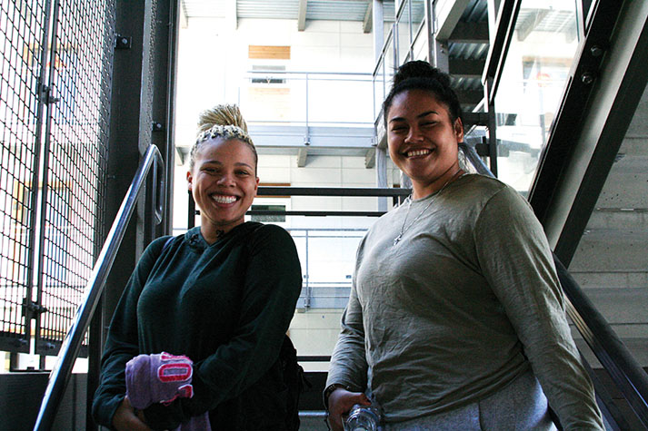Friends and dorm residents, Farryn McClenton and Judy Collins, stop and chat on the stairs of Cedar Hall. “She was the first person I talked to,” says Collins.