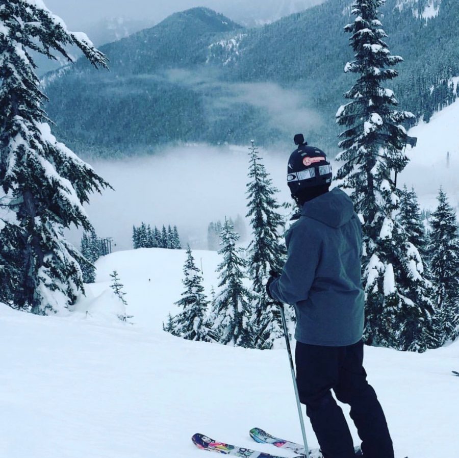 Wheeler, looking out over Stevens Pass, enjoying the quiet solitude while out adventuring off-trail.