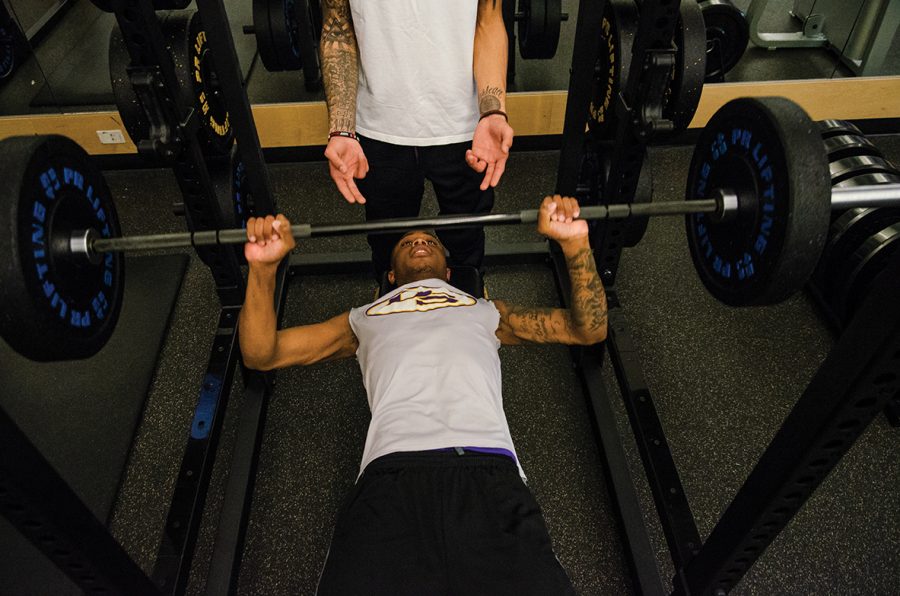 Students test out a new power rack in the Walt Price Fitness Center after a $10,000 weight room upgrade.
