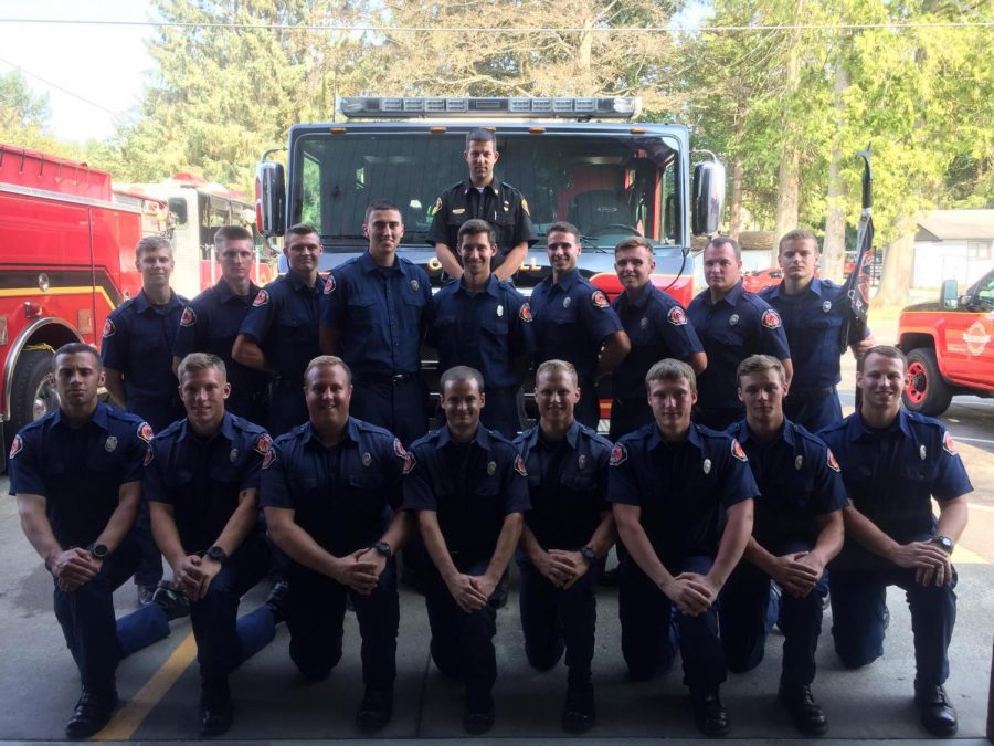 EvCC student and local volunteer firefighter, Michael Carter, (Top row, third from the right) with the 2018 GRIT recruits after completing their eight week academy.