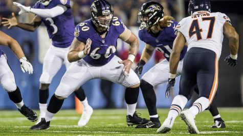 Crecelius (left) blocking in a preseason game against the Bears.