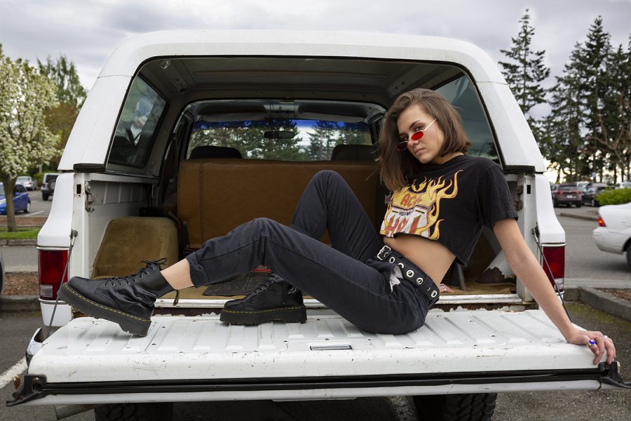 Chunky black boots paired with Dickies and a cropped AC/DC vintage t-shirt.
