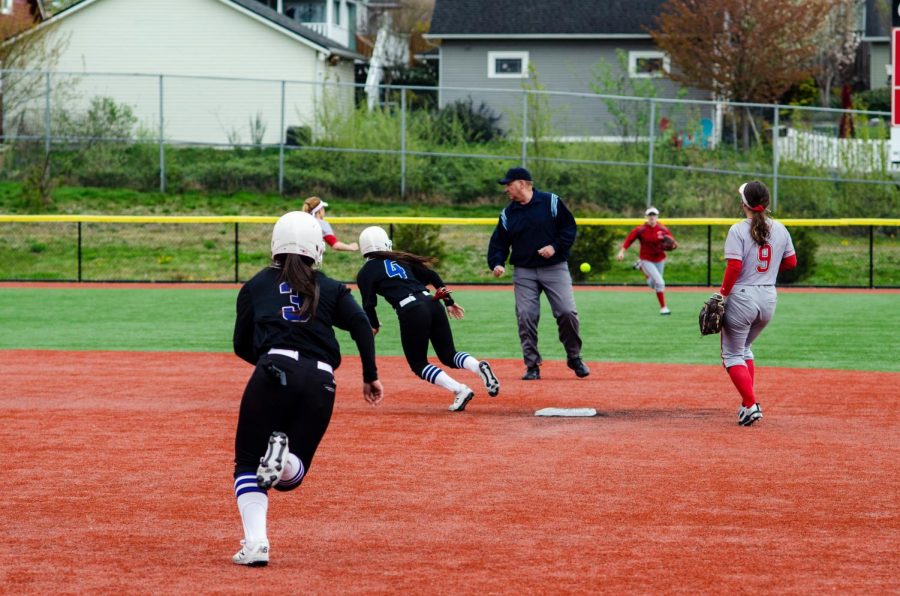 Tritons shortstop Ciena Kahui (#4) and Tritons center-fielder  Liliola Vehikite (#3)  advance base on single slapped into centerfield in top of the 6th inning of the second game of the trojans Tritons Double Header at Gaffney Field on April  12, Everett got swept in both games.