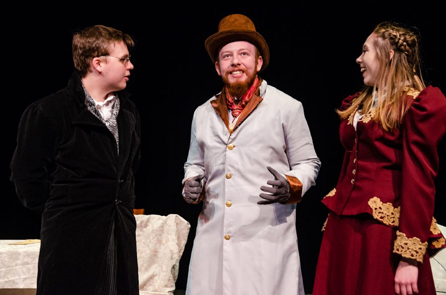 Bryce Carabello (left), Alex Hills (Center) and Ashlyn Burgess (right), shown during a dress-rehearsal, perform in Oscar Wildes Lady Windermere’s Fan. 