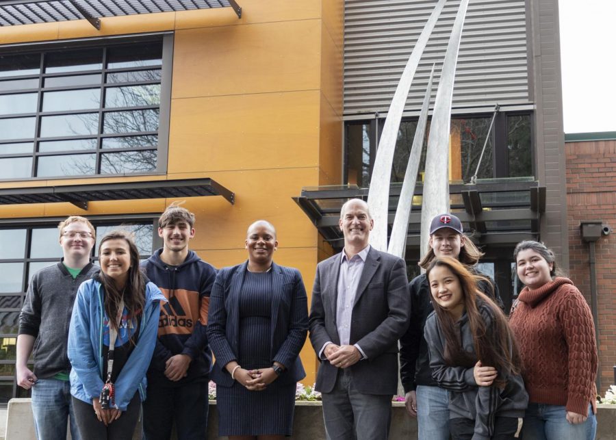 Congressman Rick Larsen  (Middle) stands next to President Willis (Left) and members of ASB in front of the Feather Star outside of the Parks Student Union after meeting to discuss Open Educational Resources, textbook prices and food insecurity on Tuesday Jan. 21. 