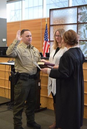 Snohomish County Sheriff, Adam Fortney, being sworn in to his position. Fortney wrote in a Facebook post on Apr. 21, 2020, “We have the right to keep and bear arms. We have the right to attend church service of any denomination. The impacts of COVID 19 no longer warrant the suspension of our constitutional rights.”