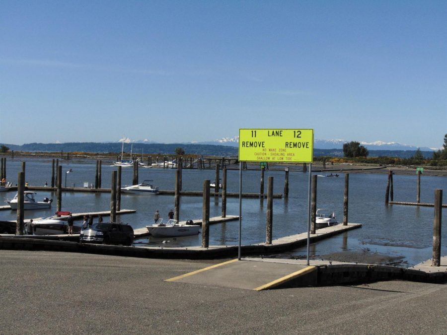 Several+boats+being+launched+follow+the+rule+of+one+per+dock+and+of+maintaining+a+6-ft+distance.+