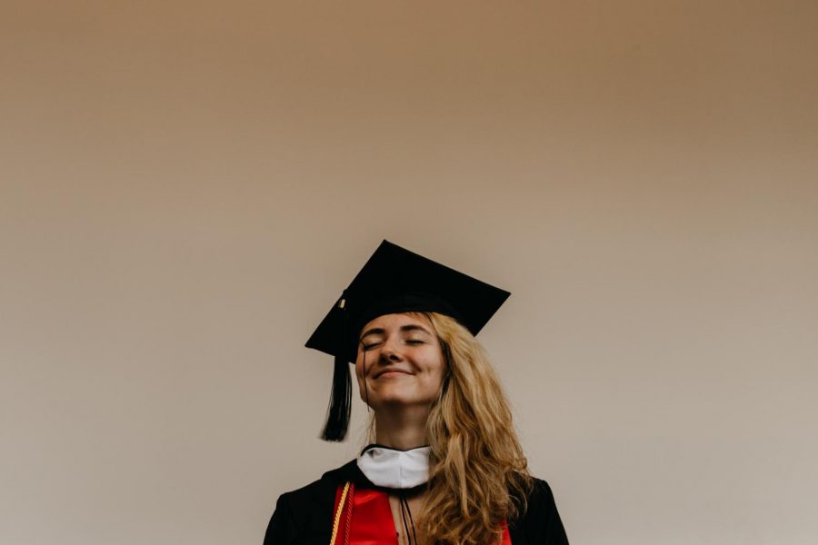 Graduate smiling onto her future.