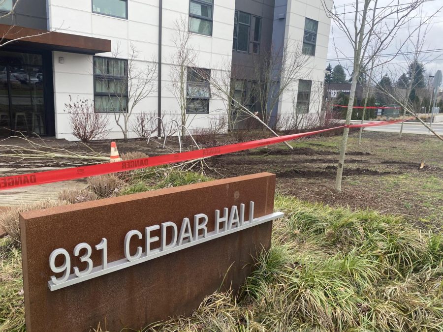 Cedar+Hall%2C+following+the+automobile+incident+that+occurred+on+February+7th%2C+2022.+Red+tape+protects+a+scene+on+carved-up+dirt+and+trampled+trees.