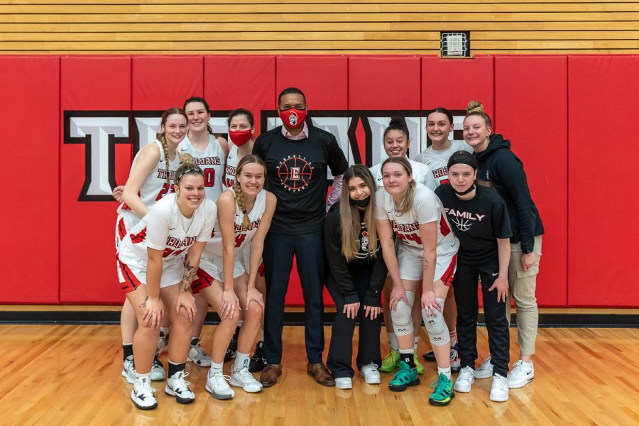 New Interim President Dr. Darrell L. Cain  stands with the EvCC Girls Basketball Team.