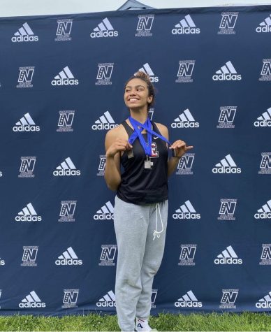 All-American Livii Fetterley posing with her medals at NWAC championships
