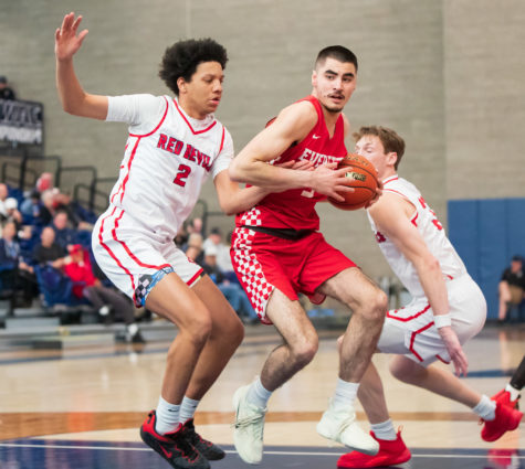 Redshirt freshman forward Tucker Molina posts up a Red Devils defender. Molina finished with a team-high 15 rebounds.