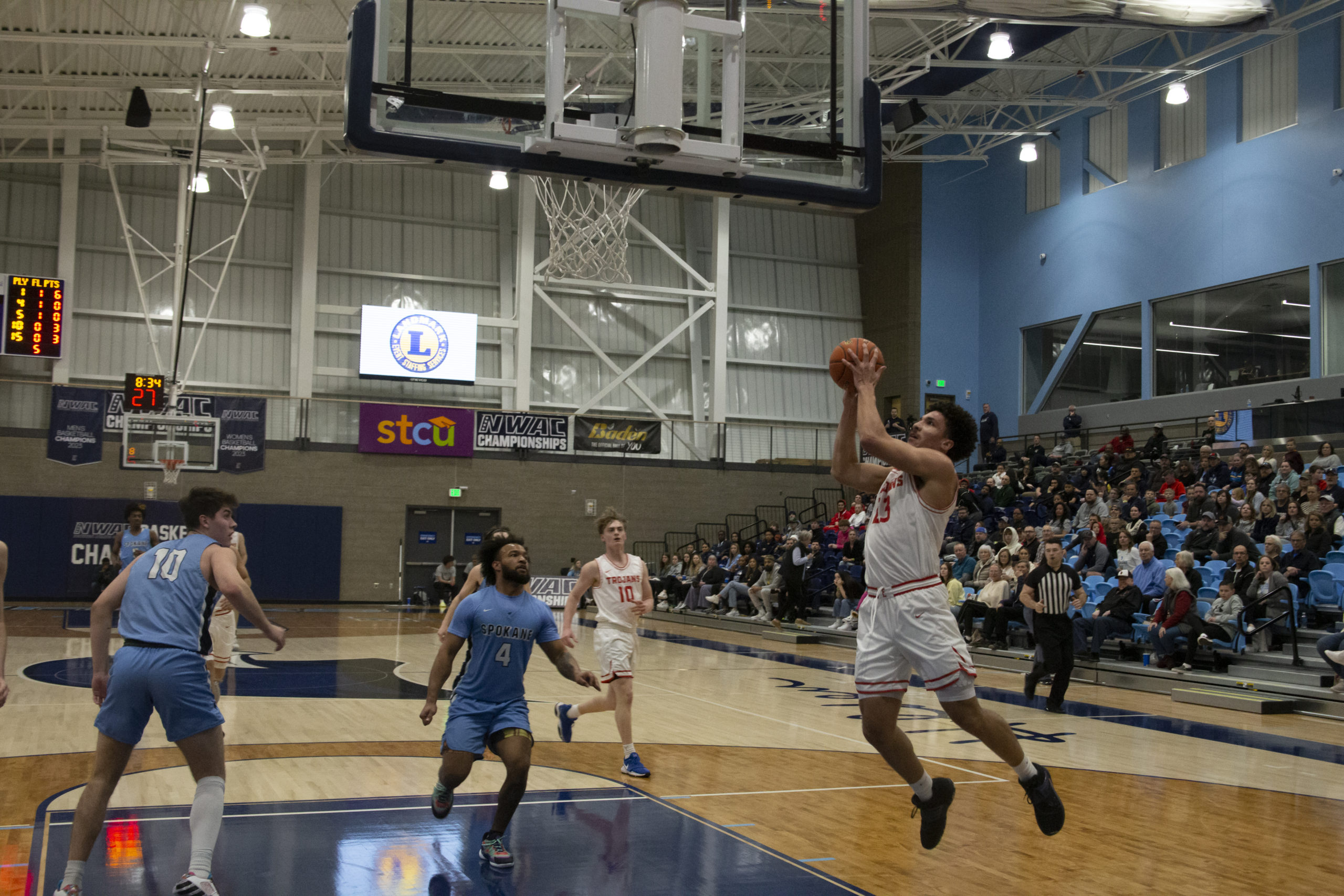 Redshirt Freshmen Jadin Penigar elevates for a fast break layup. Penigar led all scorers with 28 points in the Trojans rout of the Sasquatch.