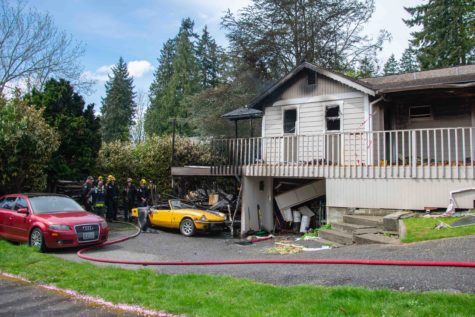 The house fire damaged most of the building and two vehicles that were underneath the deck.