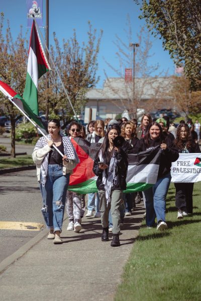 Lilyana Salazar and Danah Marouf lead students in a Palestinian solidarity protest march.