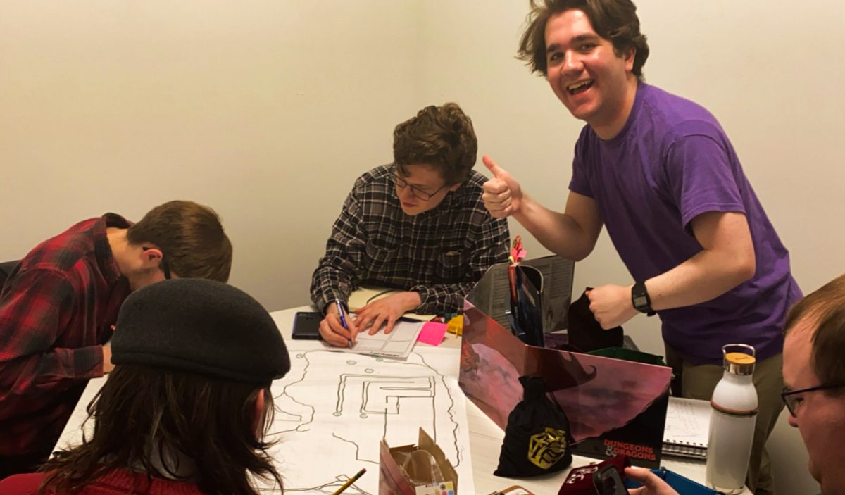 Club President and Dungeon Master Joseph Burr (right) presides over a small group of players every Friday.