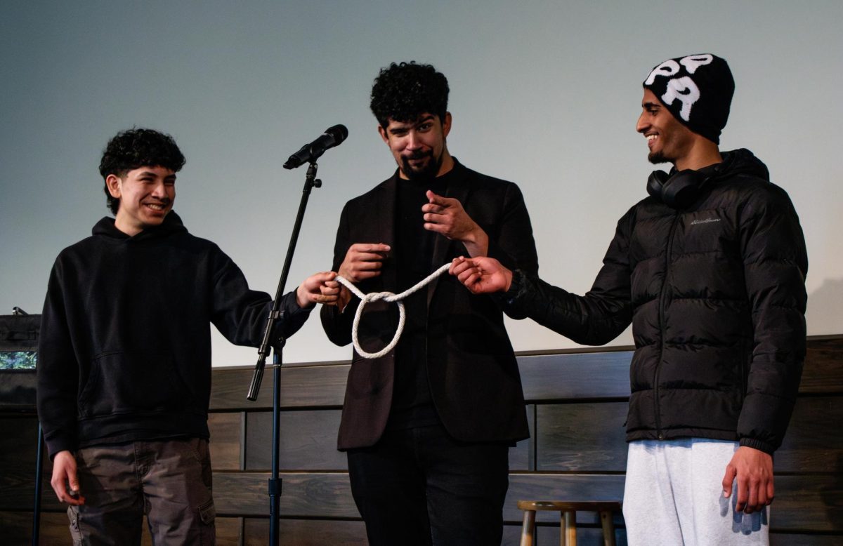 Korso believes that audience participation is a vital part of a successful show. Jesus Guillen (left) and Muhamed (last name not provided, right) help Korso on stage to tie his hands behind his back.