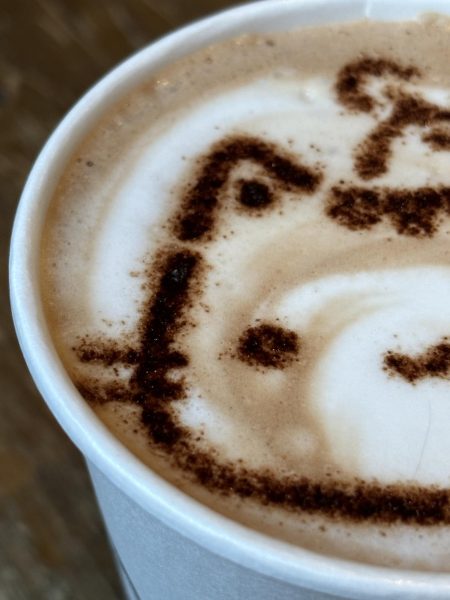 A warm latte from the Meowtropolitan Cafe, adorably decorated by the lovely baristas with a cat motif.
