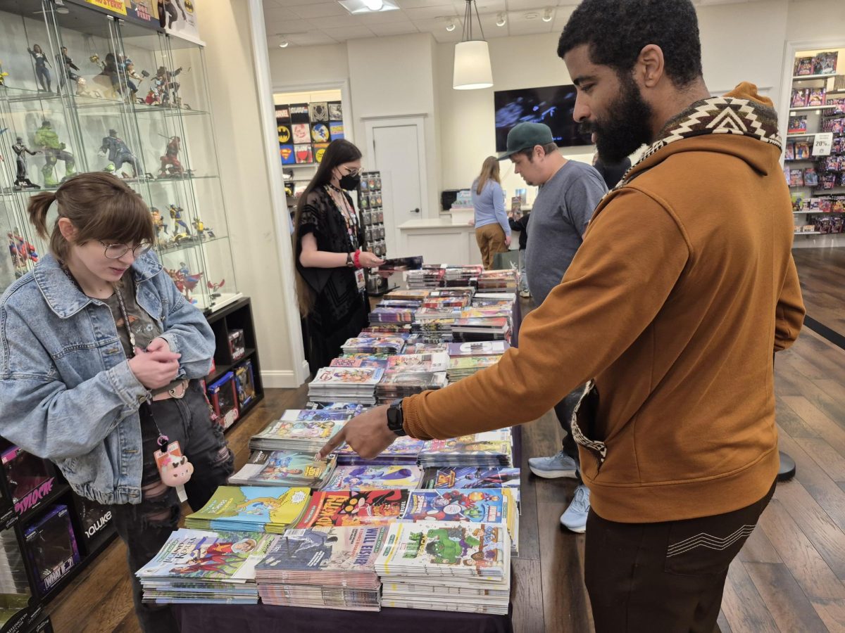 Free comics were laid out on a table where store employees helped customers obtain their free comics at Phantom Zone Comics. Customers were limited to five comics each and families were limited to eight.